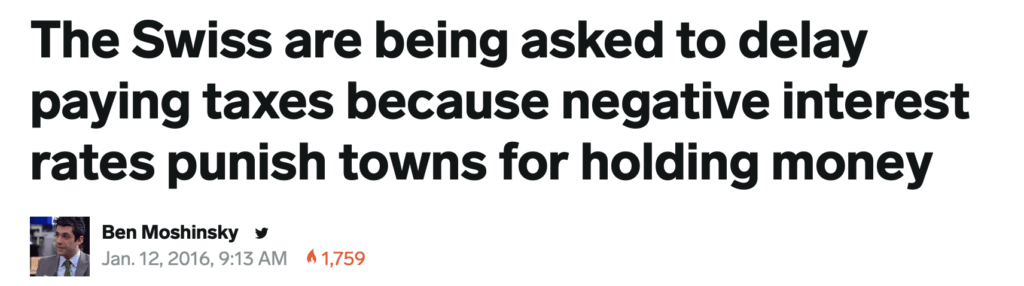 Headline stating Swiss towns are asked to delay paying taxes due to negative interest rates penalizing them for holding money; includes author Ben Moshinsky, date, and view count.