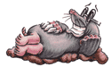 A cartoon mole lies on its back on a mound of dirt, smiling widely with its eyes open and hands resting on its belly.
